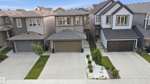 Modern two-story residence featuring light gray siding and dark trim accents - 2508 193 Street, Edmonton, AB 
