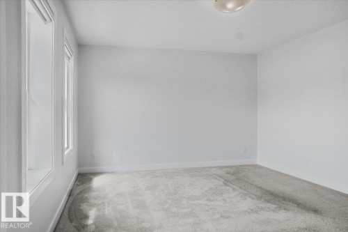 Room featuring light gray carpeting and white painted walls - 2852 Duke Crescent, Edmonton, AB 
