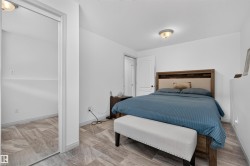 Room featuring wood-finish flooring, a neutral color palette, and a semi-flush mount ceiling light - 
