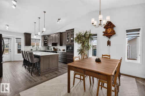 Open-concept kitchen and dining area featuring vaulted ceilings - 5006 53 Avenue, Cold Lake, AB 