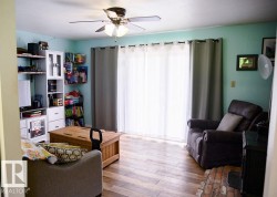 Bright living area featuring  with sliding patio door to access deck - 