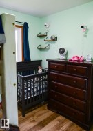 Room featuring light green walls, laminate  flooring, new windows through out the main floor - 