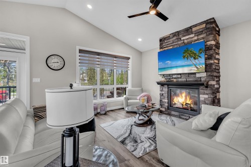 5052 Lakeshore Drive, Sylvan Lake, AB - Indoor Photo Showing Living Room With Fireplace