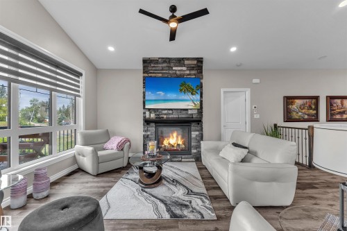 5052 Lakeshore Drive, Sylvan Lake, AB - Indoor Photo Showing Living Room With Fireplace