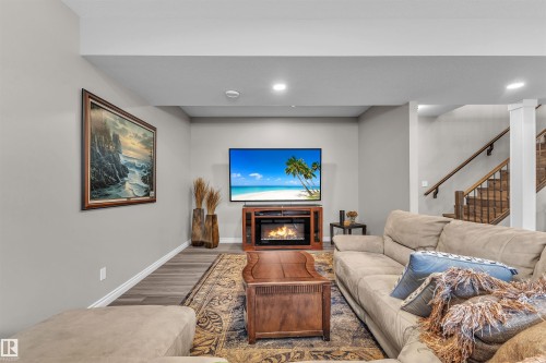 5052 Lakeshore Drive, Sylvan Lake, AB - Indoor Photo Showing Living Room With Fireplace