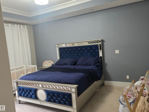 Recessed lighting illuminates a tray ceiling - 1019 175 Street, Edmonton, AB 