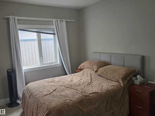 Window with white trim and privacy blinds - 1019 175 Street, Edmonton, AB 