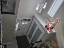 Entryway featuring a white paneled door with decorative glass inserts, a transom window, and a sidelight - 1019 175 Street, Edmonton, AB 