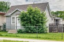 Gabled residence with light-colored siding and a shingled roof - 11939 89 Street, Edmonton, AB 