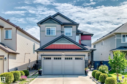 Contemporary two-story residence featuring multi-tone siding and a prominent two-car garage - 1935 Davidson Wynd Sw, Edmonton, AB 
