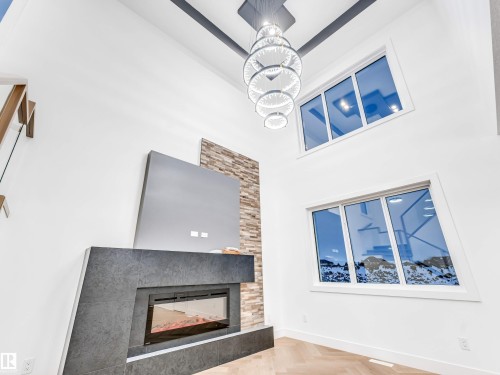2346 63 Avenue, Rural Leduc County, AB - Indoor Photo Showing Living Room With Fireplace