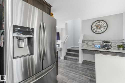Stainless steel refrigerator with ice and water dispenser - 17724 58 Street Nw, Edmonton, AB 