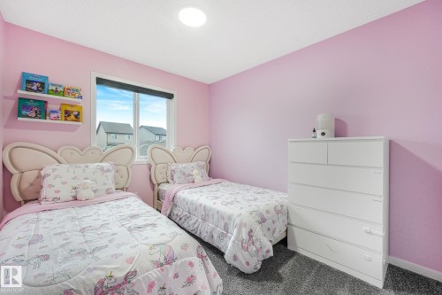 Room featuring an expansive window, gray carpet, and recessed ceiling lighting - 17724 58 Street Nw, Edmonton, AB 