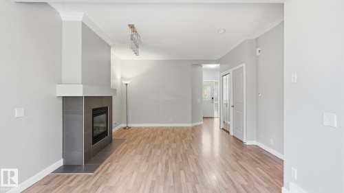 #24 6410 134 Av Nw, Edmonton, AB - Indoor Photo Showing Other Room With Fireplace