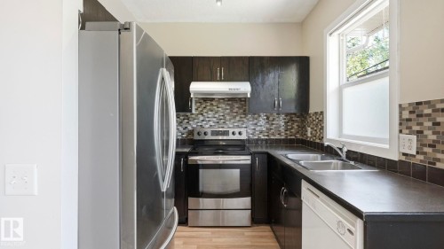 #24 6410 134 Av Nw, Edmonton, AB - Indoor Photo Showing Kitchen With Double Sink