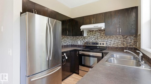#24 6410 134 Av Nw, Edmonton, AB - Indoor Photo Showing Kitchen With Double Sink