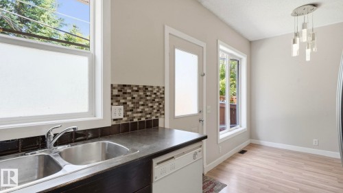 #24 6410 134 Av Nw, Edmonton, AB - Indoor Photo Showing Kitchen With Double Sink