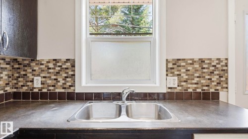 #24 6410 134 Av Nw, Edmonton, AB - Indoor Photo Showing Kitchen With Double Sink