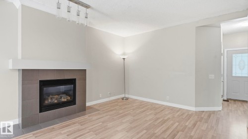 #24 6410 134 Av Nw, Edmonton, AB - Indoor With Fireplace