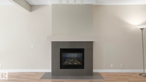 #24 6410 134 Av Nw, Edmonton, AB - Indoor Photo Showing Living Room With Fireplace