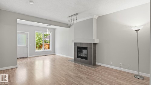 #24 6410 134 Av Nw, Edmonton, AB - Indoor Photo Showing Living Room With Fireplace