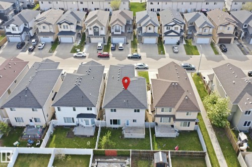 Two-story home with a light-colored exterior and dark shingle roof - 16807 54 Street, Edmonton, AB - Other