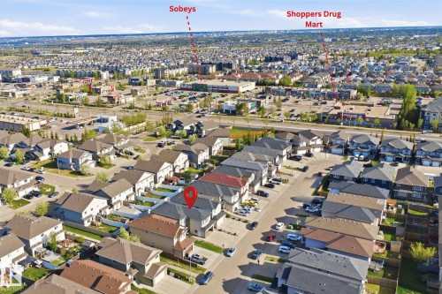 Residential street featuring a collection of detached homes with varied exterior finishes - 16807 54 Street, Edmonton, AB - Outdoor With View