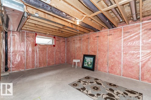 Unfinished basement area featuring exposed ceiling joists, ductwork, and insulated wall framing - 39 Vega Avenue, Spruce Grove, AB - Indoor Photo Showing Basement
