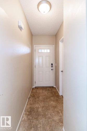 Entryway with neutral wall tones and square tile flooring - 39 Vega Avenue, Spruce Grove, AB - Indoor Photo Showing Other Room