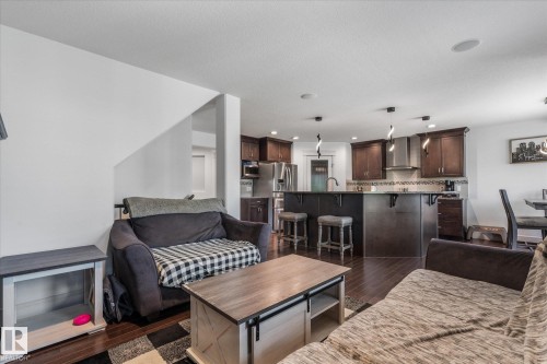 Open-concept living space featuring wood-finish flooring - 6 Sedona Place, Fort Saskatchewan, AB - Indoor Photo Showing Other Room