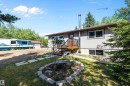 Split-level residence featuring a gray exterior and a brown trim roofline - 53257 Rge Road 211, Rural Strathcona County, AB  - Outdoor 