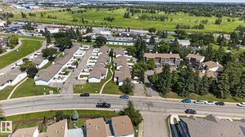 Aerial perspective showcasing a residential community with varied housing styles - 1071 Millbourne Road Nw, Edmonton, AB 