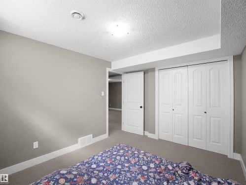 Neutral-toned walls complement the textured ceiling - 4021 158 Avenue Nw, Edmonton, AB - Indoor Photo Showing Bedroom