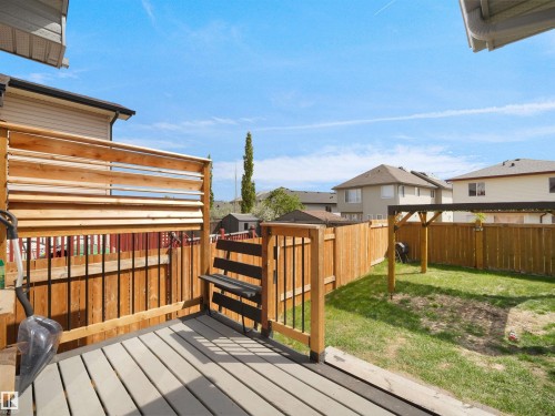 Rear deck featuring composite decking and a privacy screen - 4021 158 Avenue Nw, Edmonton, AB - Outdoor With Exterior