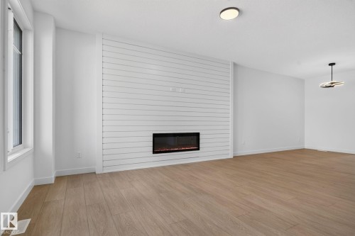 109 Westwind Drive, Spruce Grove, AB - Indoor Photo Showing Living Room With Fireplace