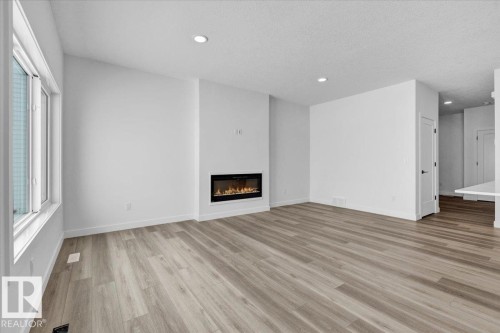 139 Caledon Crescent, Spruce Grove, AB - Indoor Photo Showing Living Room With Fireplace