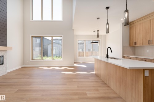 117 Garneau Gate, Spruce Grove, AB - Indoor Photo Showing Kitchen With Fireplace