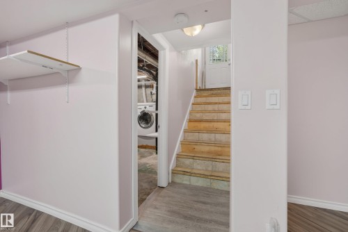 Stairway with tile treads and a white door leading outdoors - 3 Bristow Crescent, Spruce Grove, AB - Indoor Photo Showing Other Room