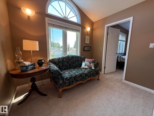 Vaulted ceiling with an arched transom window over a large casement window - 5604 57 Avenue, Beaumont, AB 