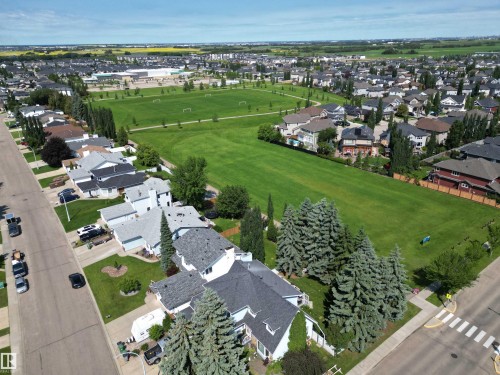 Expansive green spaces featuring manicured lawns and sports fields - 5604 57 Avenue, Beaumont, AB 