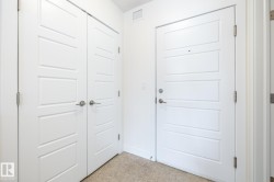 Panel doors featuring brushed nickel hardware - 