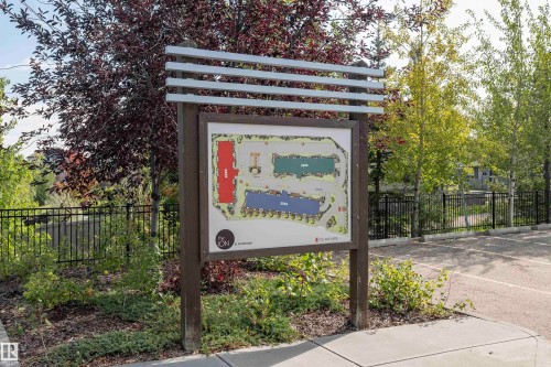 Outdoor informational kiosk featuring a site map with distinct building layouts - #215 2590 Anderson Wy Sw, Edmonton, AB - Outdoor