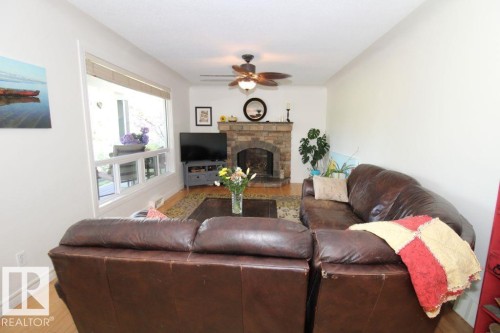7715 84 Avenue, Edmonton, AB - Indoor Photo Showing Living Room With Fireplace