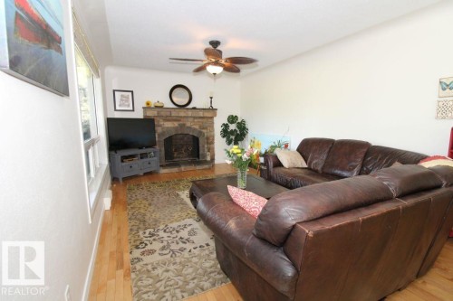 7715 84 Avenue, Edmonton, AB - Indoor Photo Showing Living Room With Fireplace