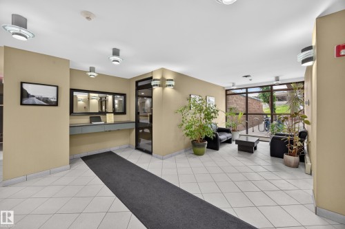 Building lobby featuring light-colored tile flooring - #602 9725 106 St Nw, Edmonton, AB 