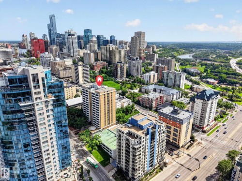 Aerial perspective showcasing a vibrant urban core with a river and parkland in the distance - #602 9725 106 St Nw, Edmonton, AB 