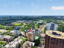 Urban setting featuring high-rise buildings and surrounding green spaces - 