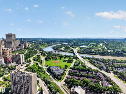 Expansive urban landscape featuring a prominent river, multiple bridges, high-rise buildings, and extensive green spaces - #602 9725 106 St Nw, Edmonton, AB 
