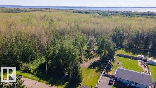 Expansive wooded property with a distant water body backdrop - 4701 34 St., Rural Wetaskiwin County, AB 