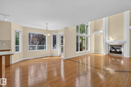 610 Hunters Close Nw, Edmonton, AB - Indoor Photo Showing Living Room With Fireplace
